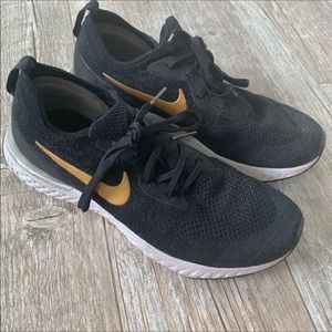 Nike Epic react tennis shoes black gold 9.5
